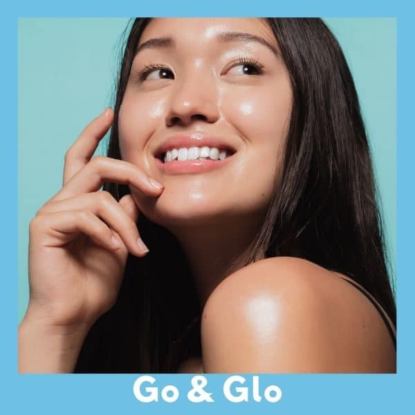 Woman smiling and glowing after a go & glo treatment at Docere.
