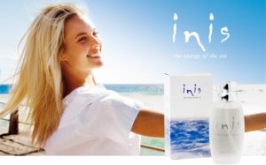 Woman smiling and modeling for INIS Fragrances of Ireland products.