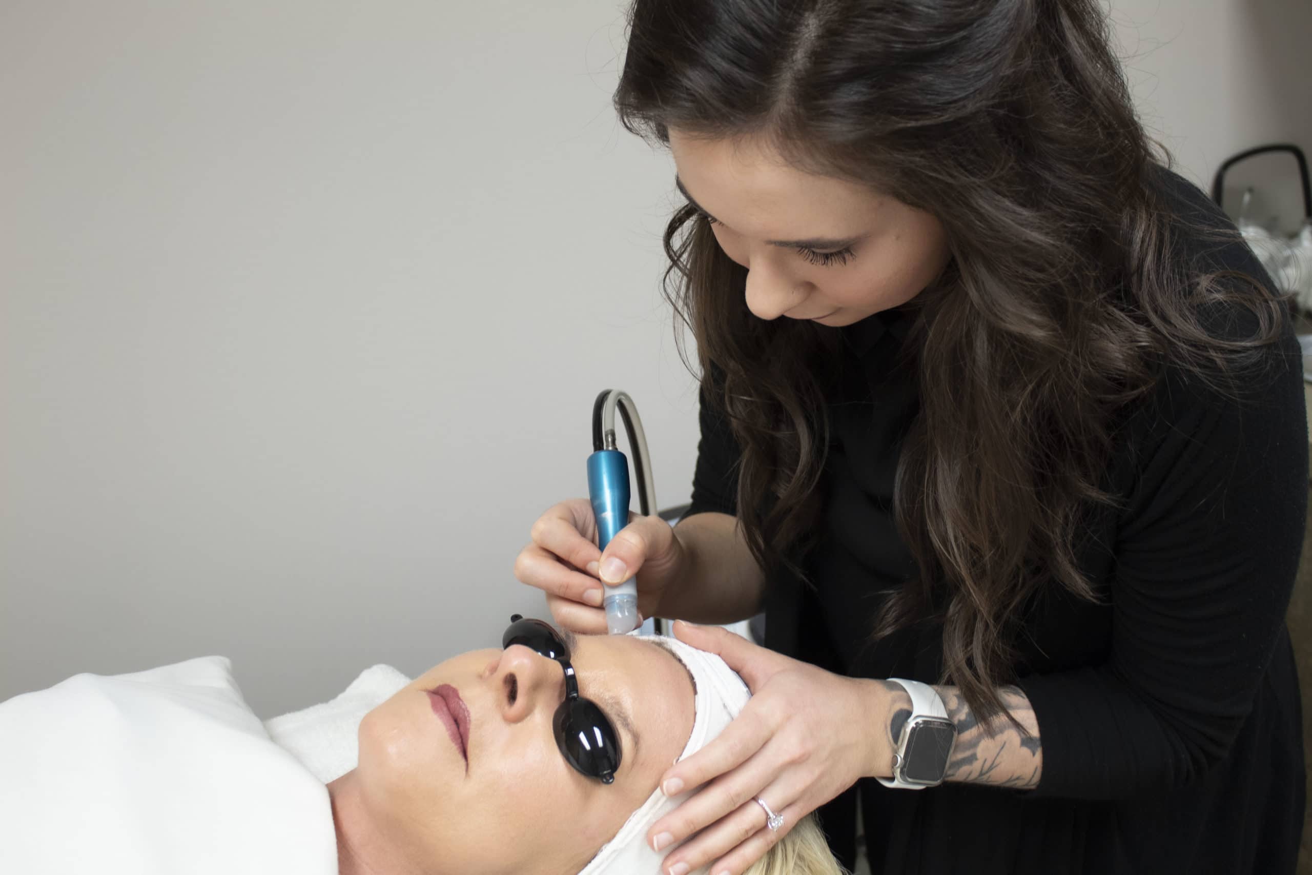 Docere specialist giving a signature facial treatment to a client.