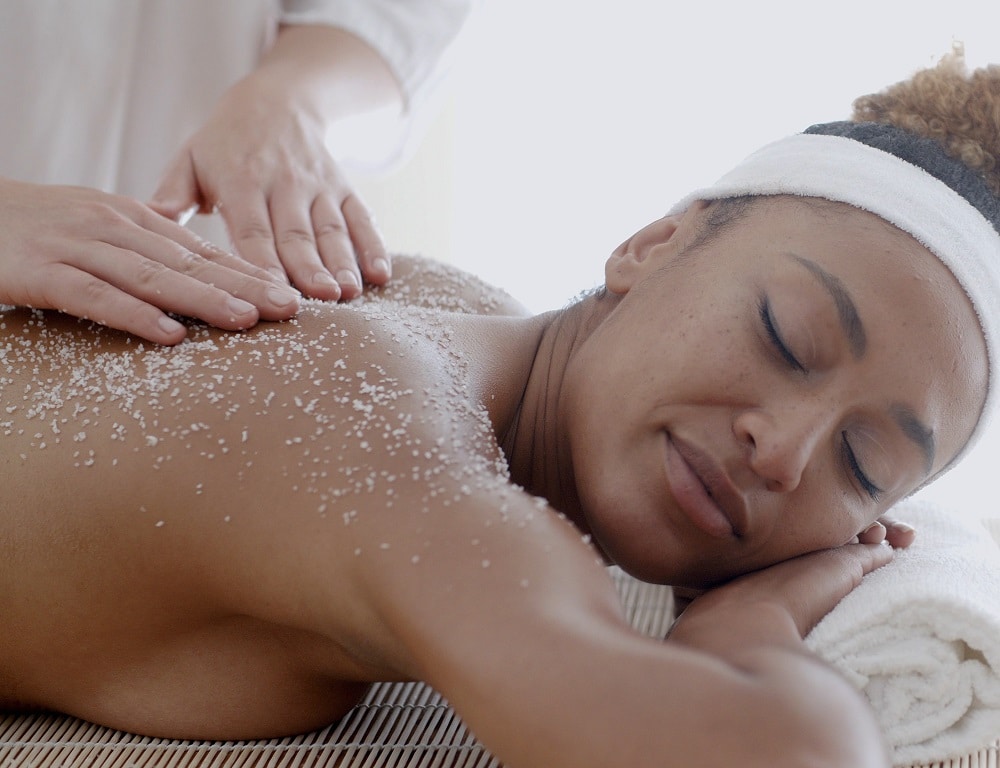 Female Getting A Salt Scrub Treatment